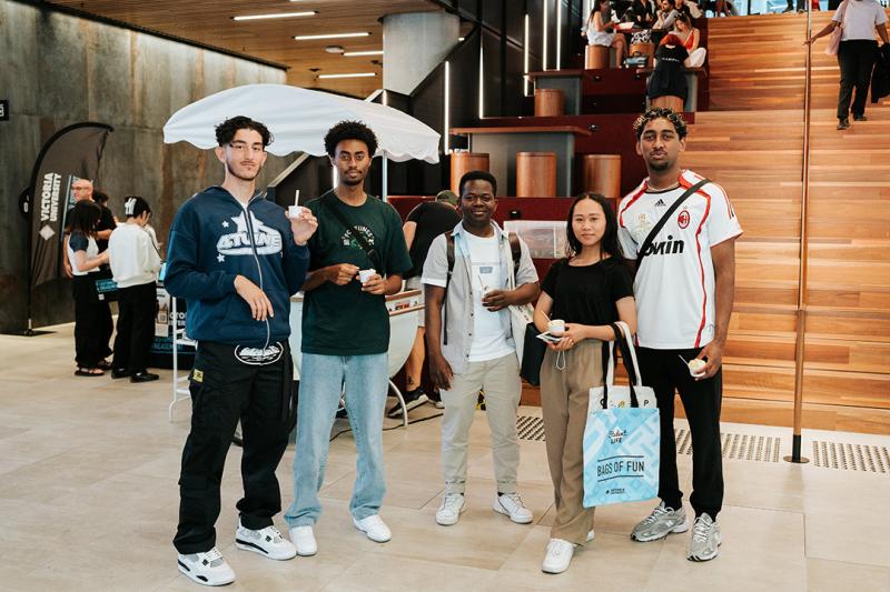 A group of young people in a modern foyer