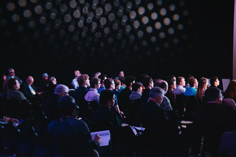 An audience in a modern conference theatre