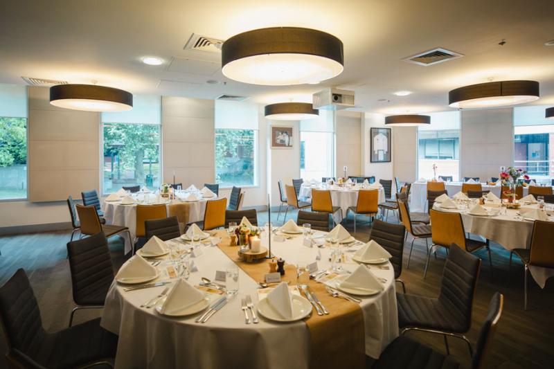 VenU restaruant interior. Inside are various decorated tables and chairs.