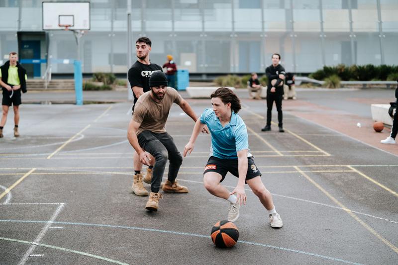 Students playing basketball at Sunshine's O-Fest.