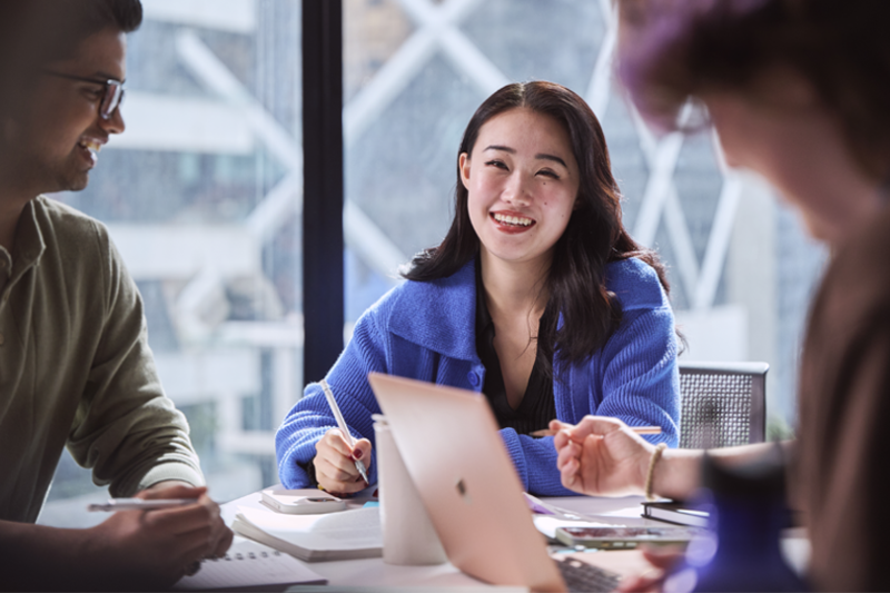 Three students collaborating at VU City Tower.