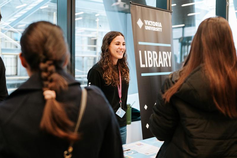 students at the library stall