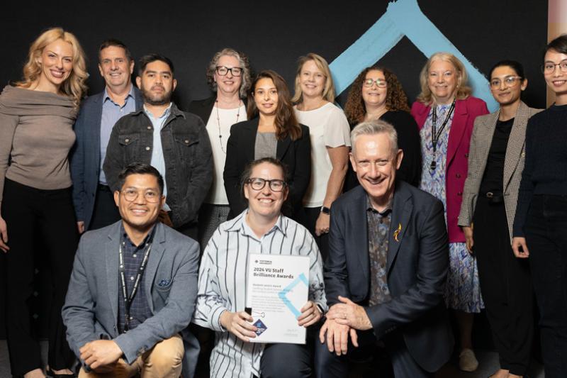 12 people smile at the camera