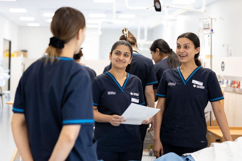 Victoria university nursing students talking to each other in lab