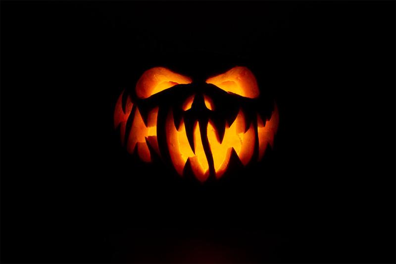 Spooky jack o'lantern lit up from within.