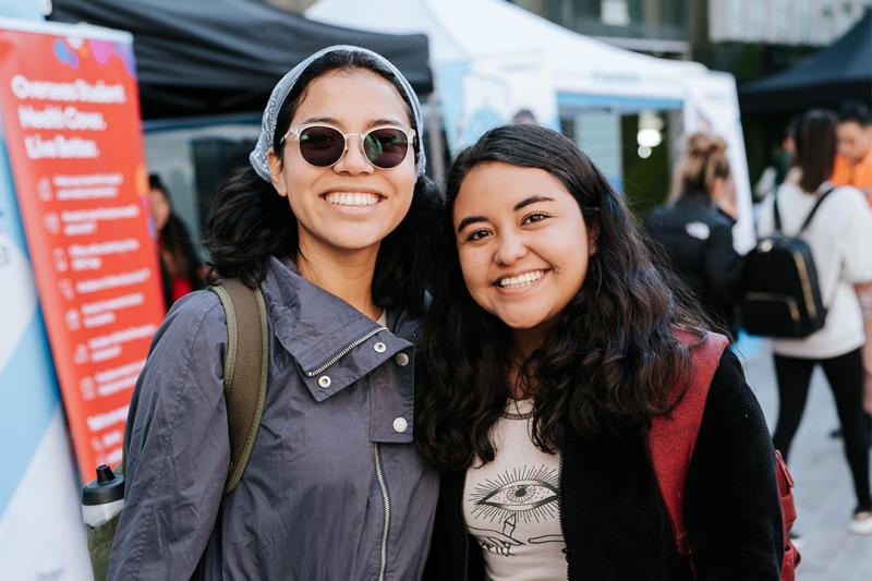 Two students smiling at the VU Enrolment Carnival.