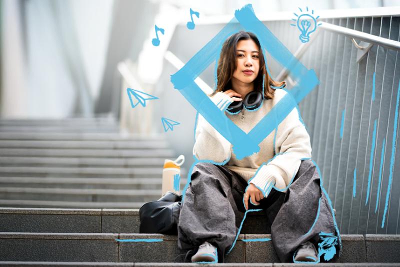 Student sitting on stairs at VU campus