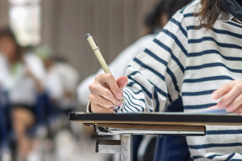 School student taking an exam.