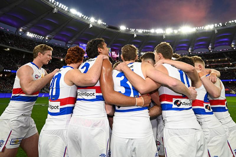 Western Bulldogs players huddle together ahead of their 2022 elimination final against the Fremantle Dockers at Optus Stadium in Perth.