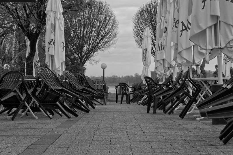  Black and white photo of empty outdoor cafe