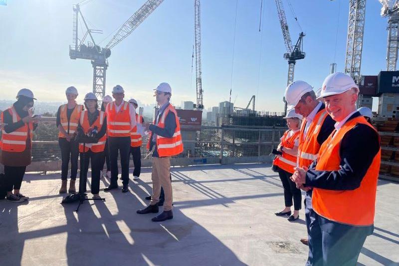  VU leaders with State Government officials in high vis on hospital construction site