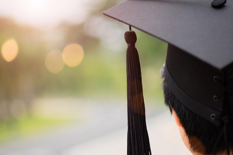  Close up of a graduation hat on student's head