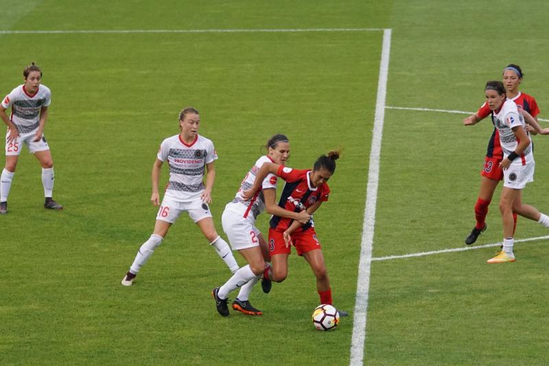  Women playing soccer
