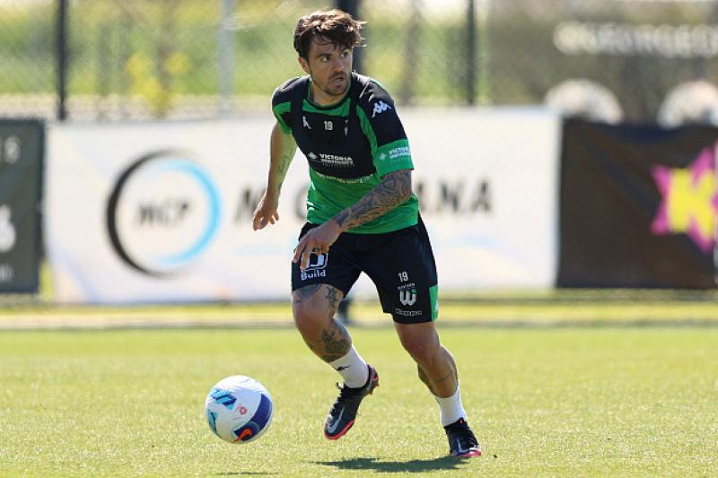 Josh risdon running towards a ball