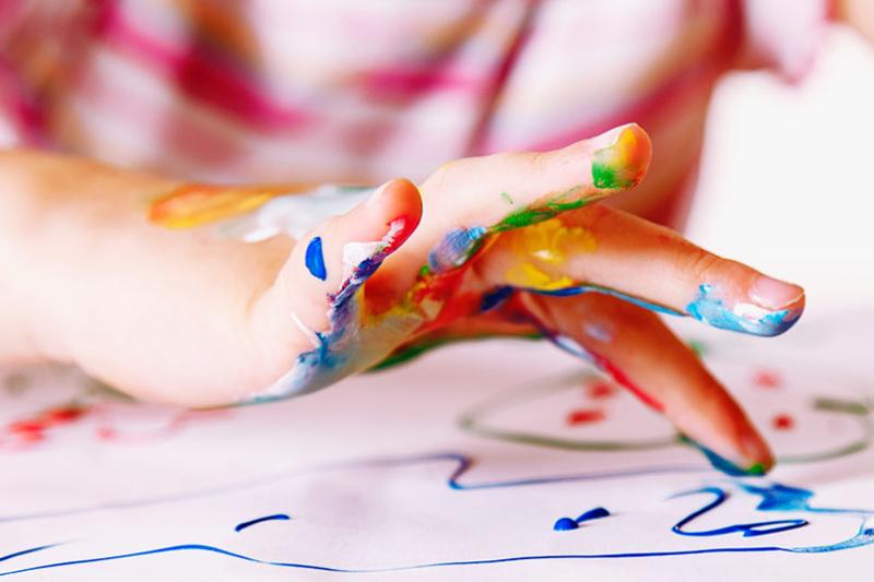  Child fingerpainting.