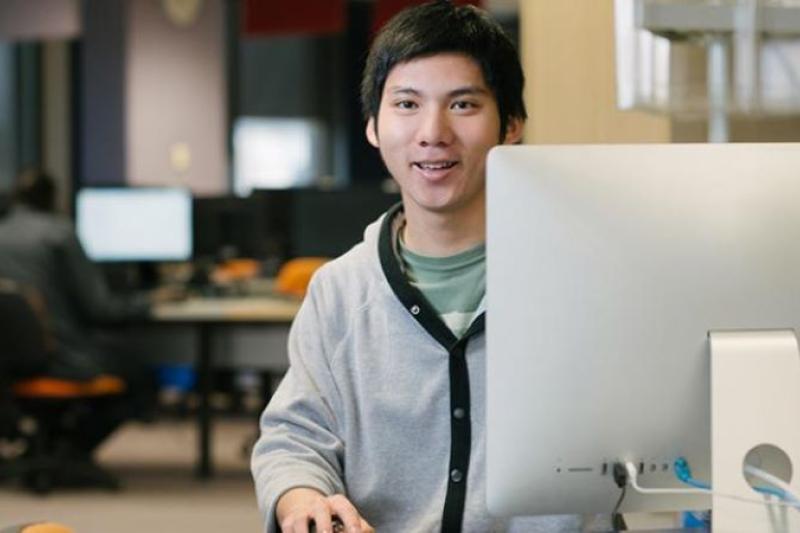  Student enrolling at computer