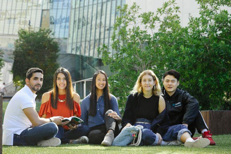  Students sitting on grass
