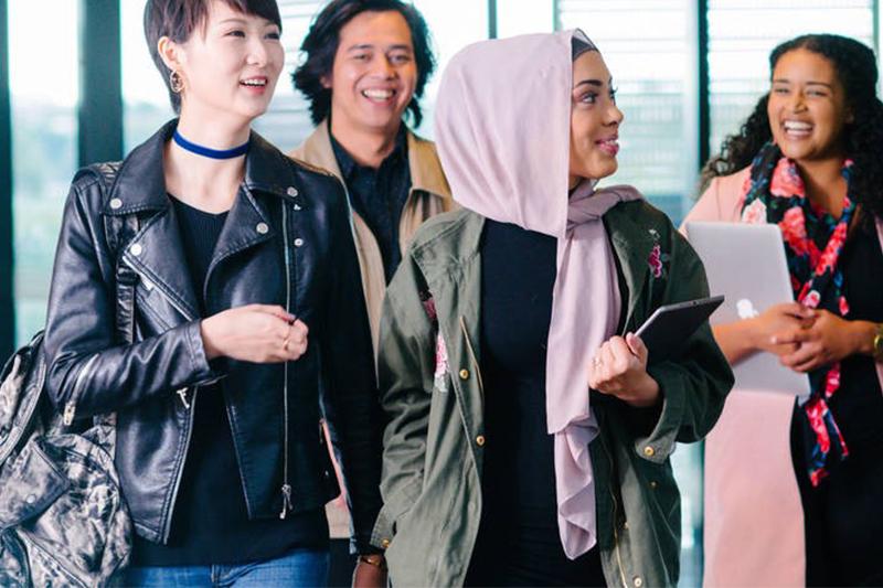 A group of students laughing together.