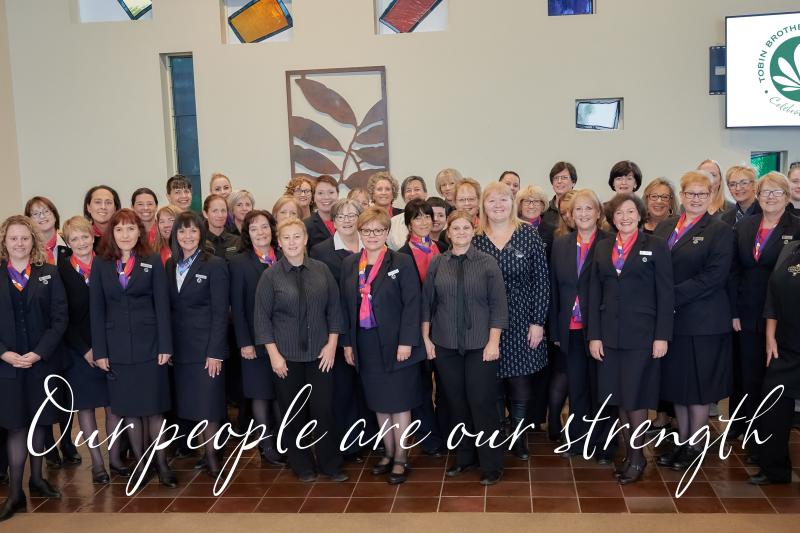 Staff of Tobin's with 'Our people are our strength' in text