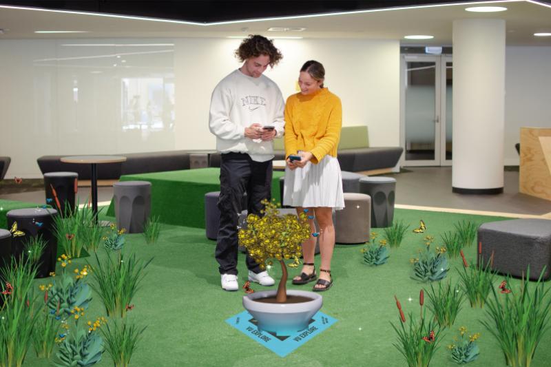 Two people using the VU App to experience augmented reality.