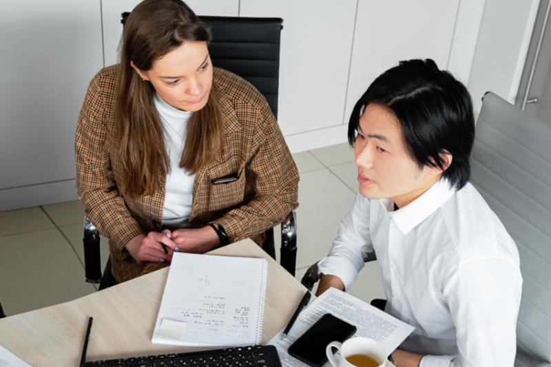  Two law graduates in an office working