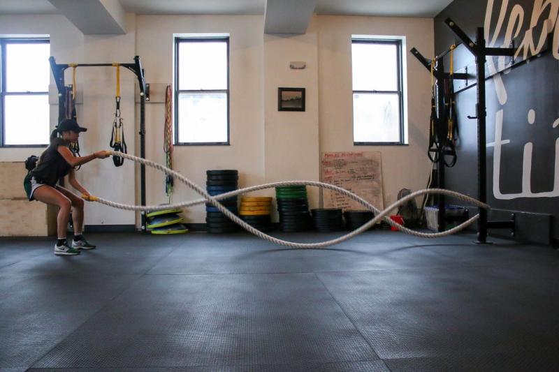  Woman working out with ropes