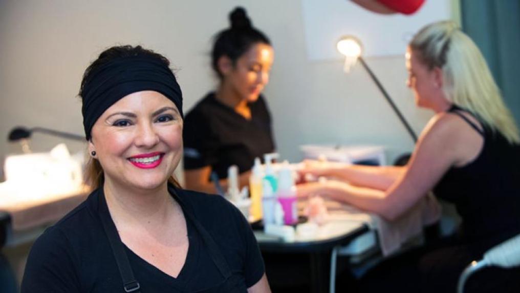 Beauty students and clients in the salon.