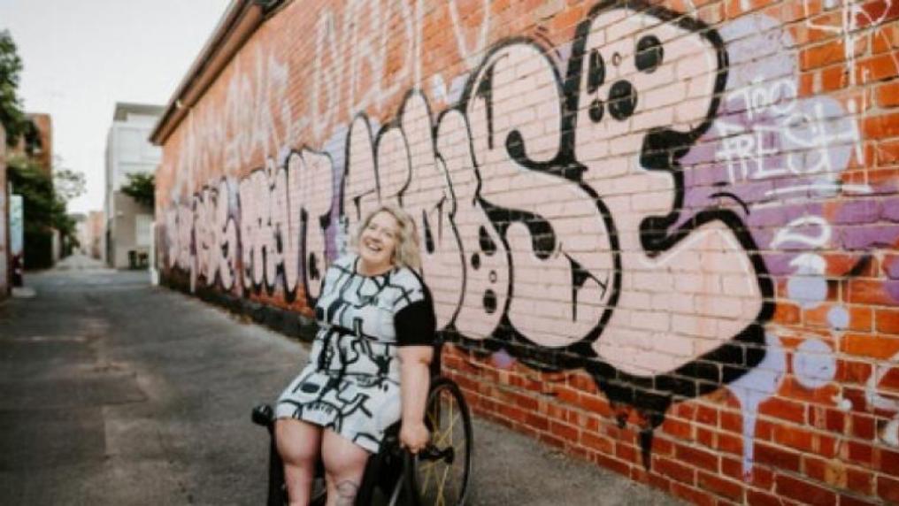 Elle Steele posing in a laneway