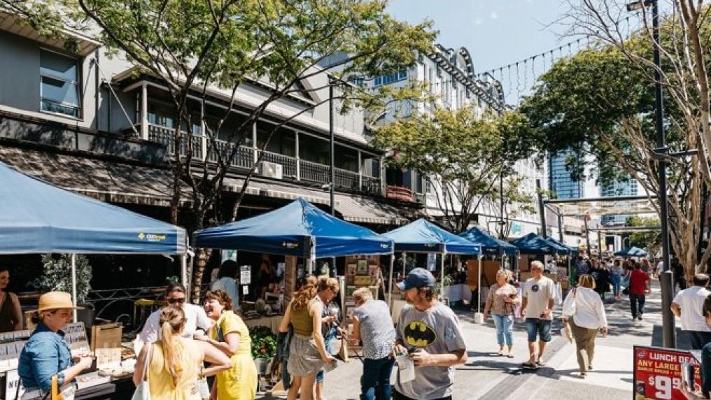 people mingling, walking through the Brunswick Market stalls in Fortitude Valley