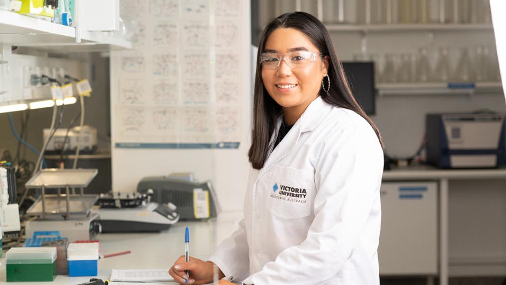 Stella Rose Lay in a VU lab coat in a lab