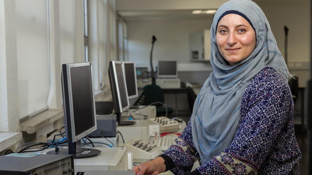 Woman in hijab in technical lab