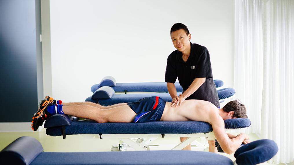 A Western Bulldogs player receives a massage at VU's Whitten Oval massage clinic.