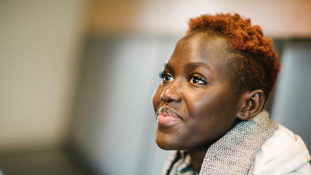 A student smiles.