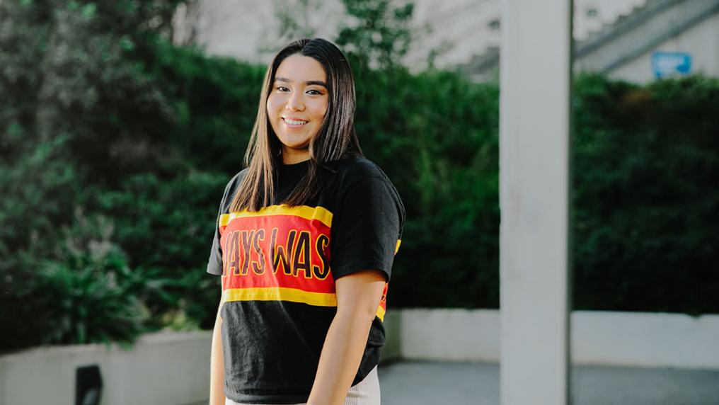 Science student Stella Rose Lay stands wearing a t-shirt that reads 'Always was'.