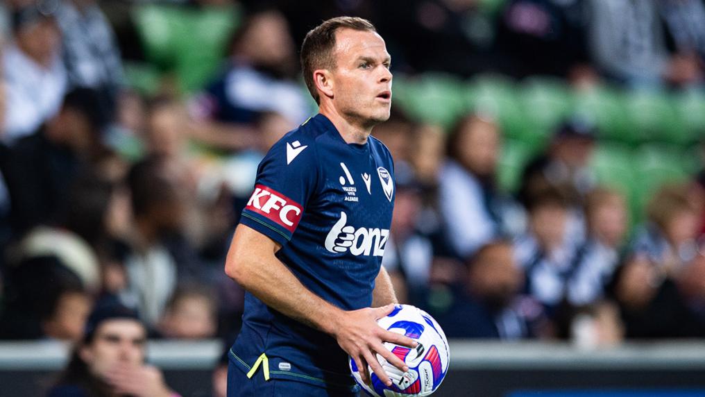 Professional male soccer (football) player in a stadium game