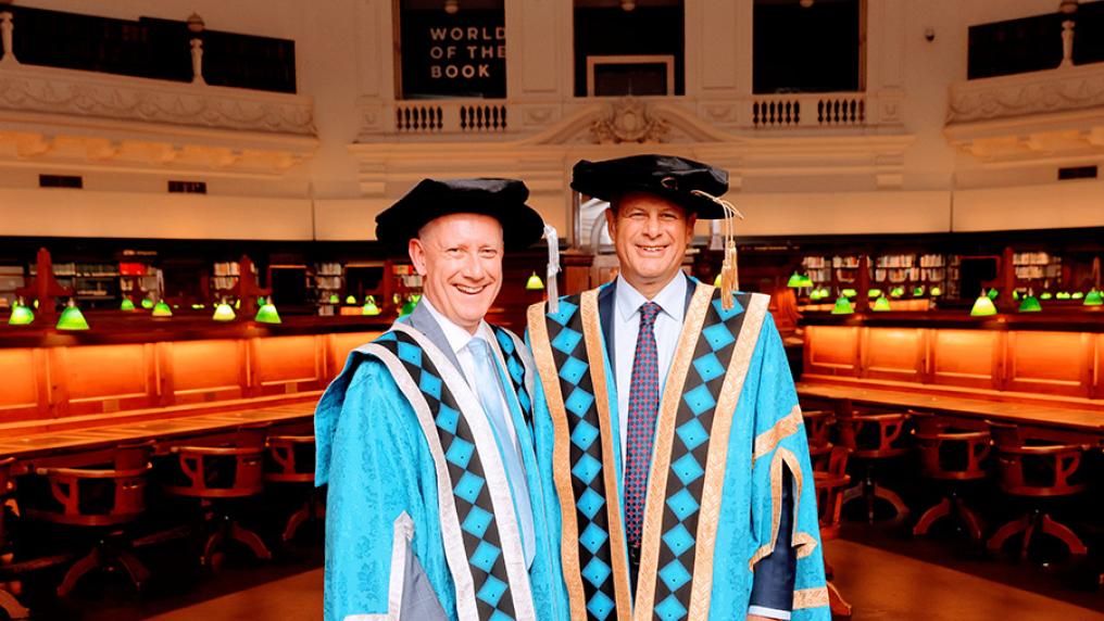 Vice-Chancellor Adam Shoemaker and Chancellor Steve Bracks in graduation robes