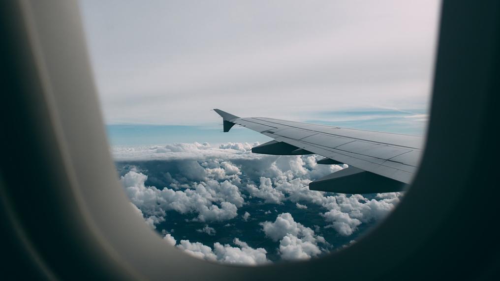 Looking at the wing of an airplane out the window.