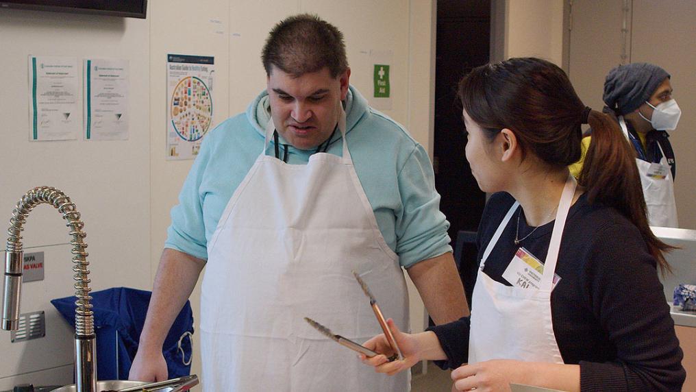 Students learning how to cook as part of a CHEW program.