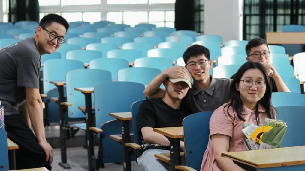 Small group of Chinese students in lecture theatre