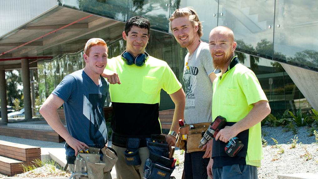 Trades students standing outside the Sunshine Construction Hub.