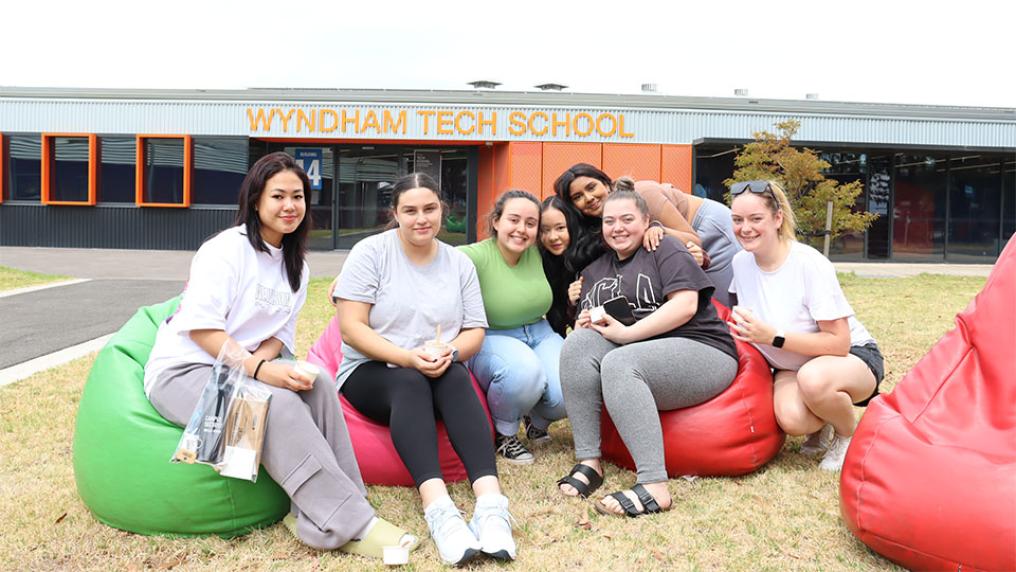 A group of students sitting on beanbags outside VU's Werribee campus.