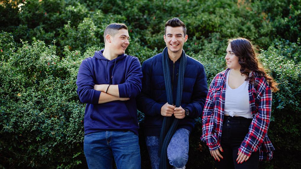 Group of VU students at Footscray Park campus in front of greenery.