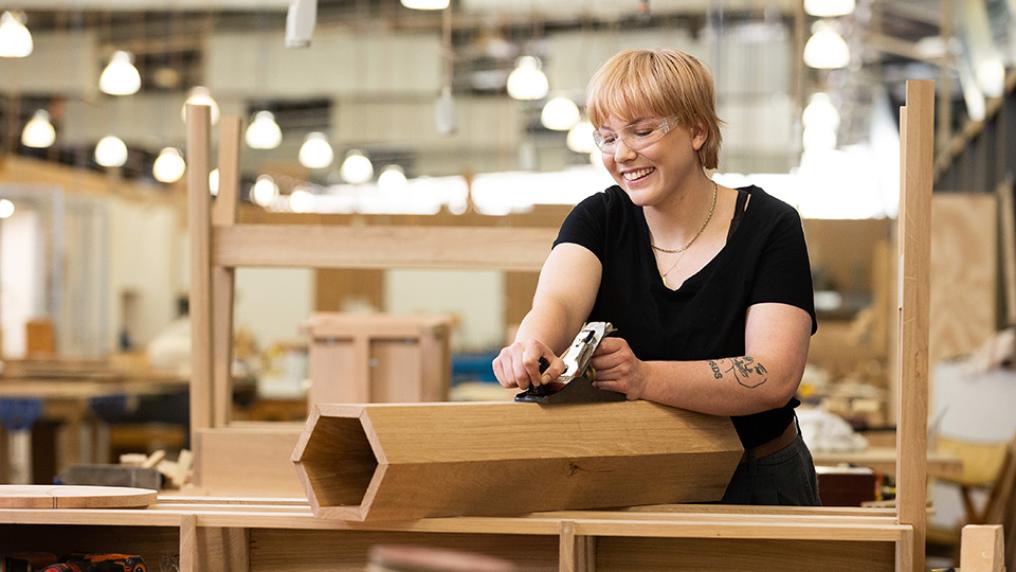 Tess, Cert III in Cabinetmaking student, working on a project
