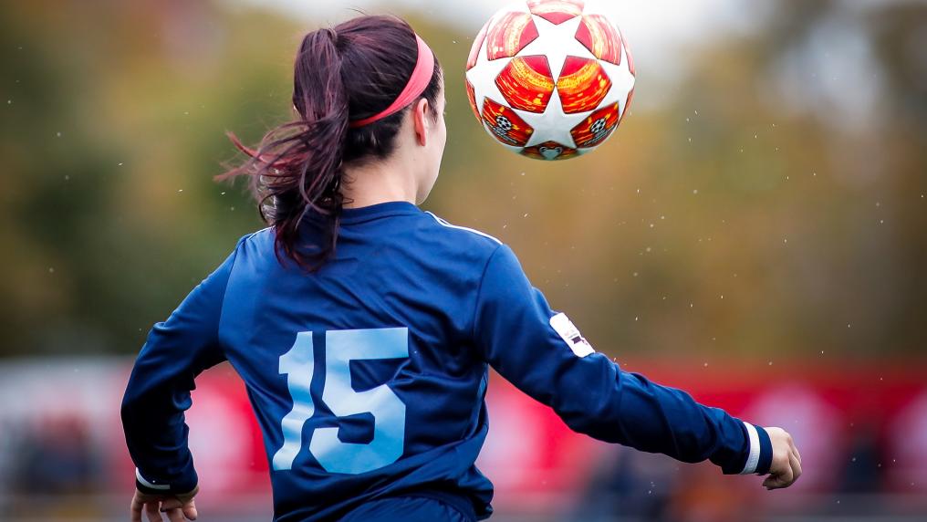 Young girl playing soccer