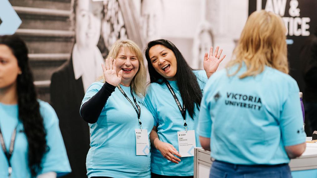 Two smiling female staff members at Open Day 2023