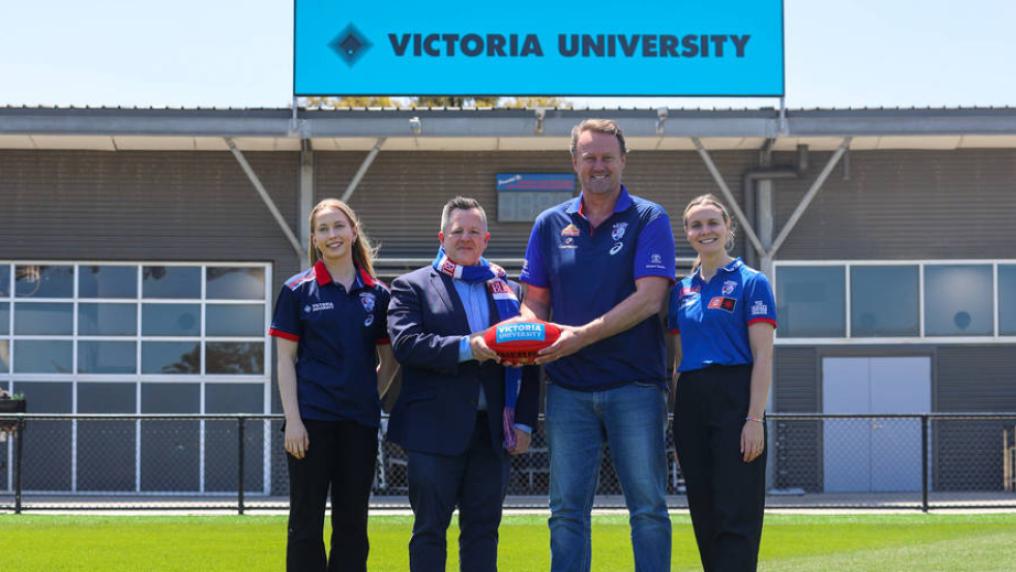 Group of people in front of VU high performance centre at Whitten Oval