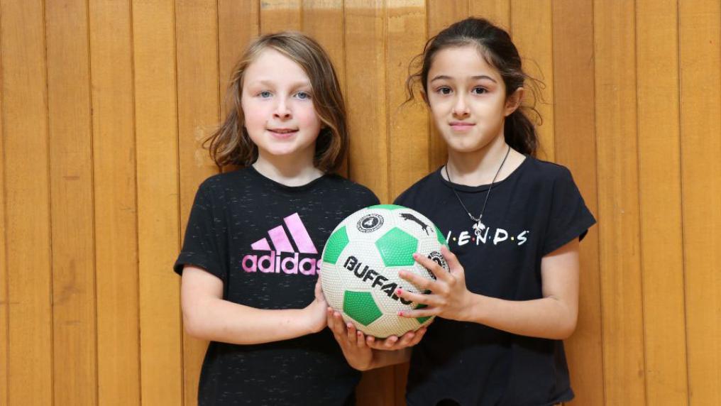 Kids with a soccer ball