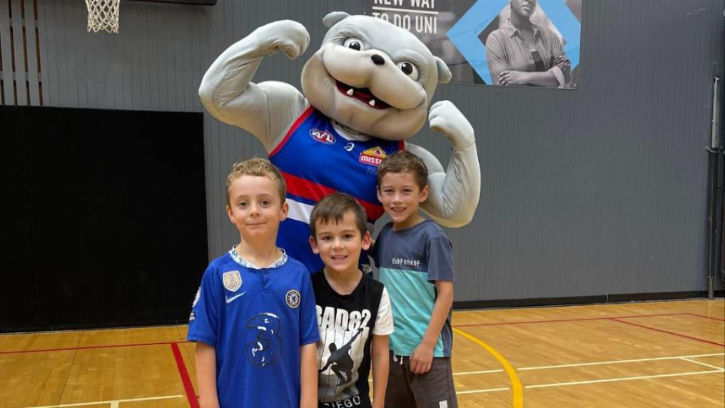 Kids with Western Bulldogs mascot