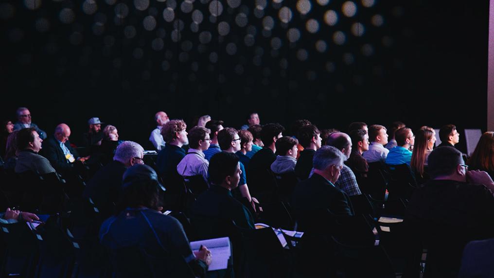 An audience in a modern conference theatre