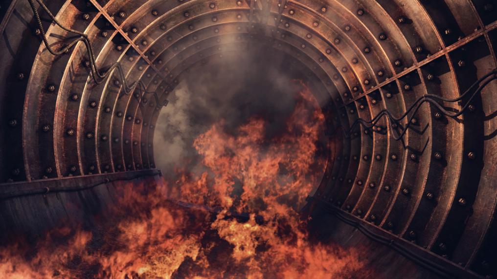 A fire taking place inside a round metal structure